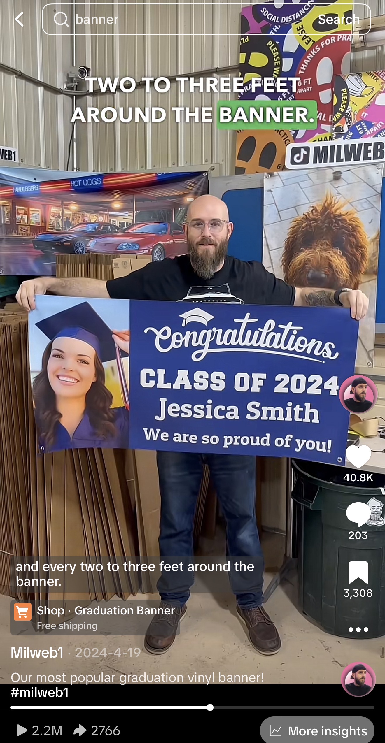 Milweb1 owner holding our most popular graduation banner - 2.2M views on TikTok